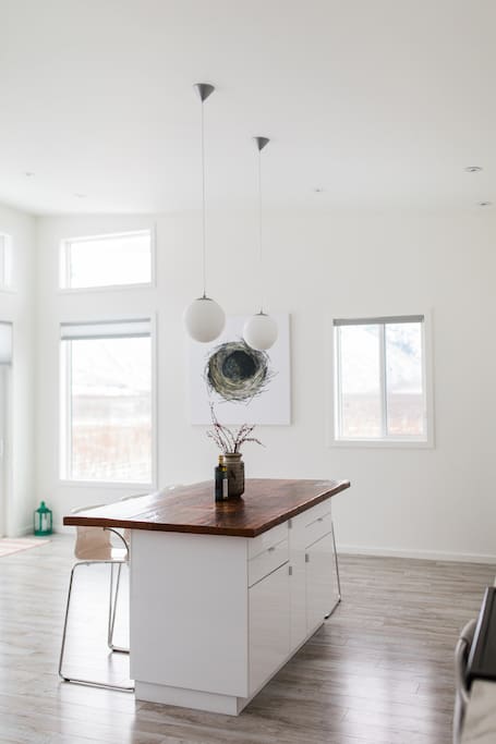 Vaulted ceilings and floor to ceiling windows make for stunning views of the mountains and vineyards