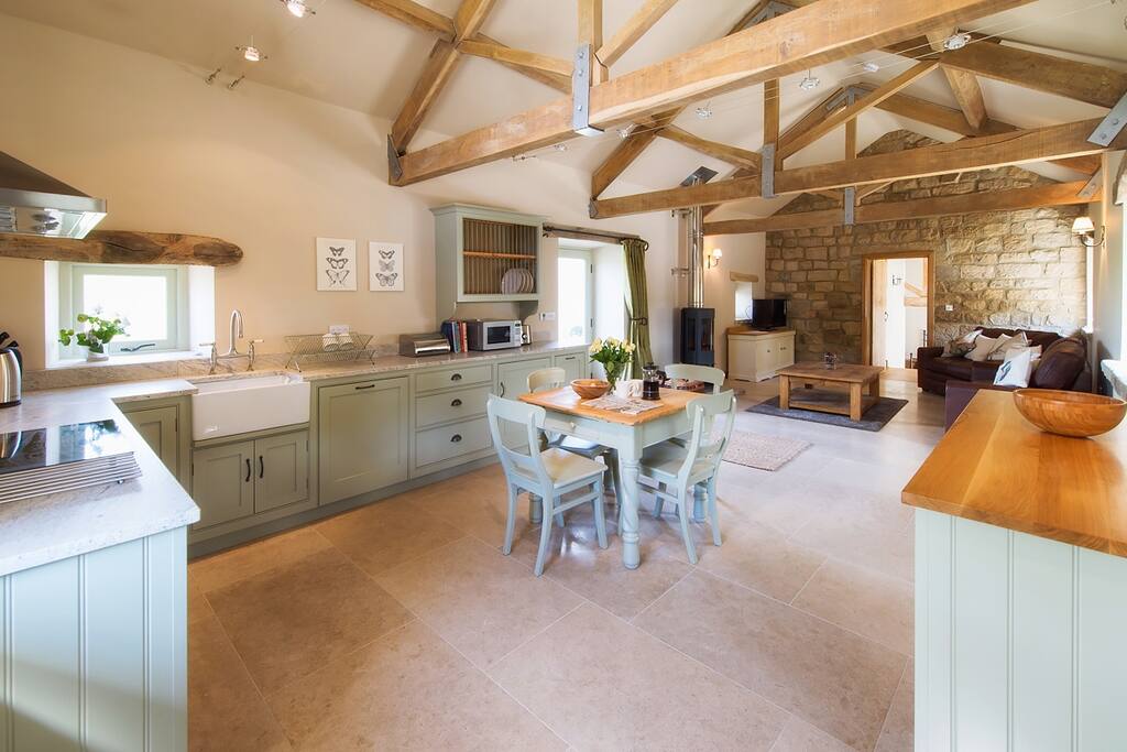 Large beamed space is tastefully decorated in greys with a dining table seating 4 guests, luxurious leather seating and a contemporary log burner (Please note this becomes hot so children must be supervised)