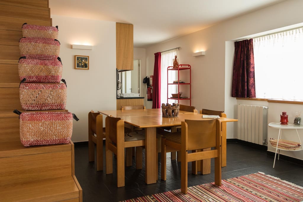 The living room combined with kitchen/dining area. Staircase leading up to the bedrooms.