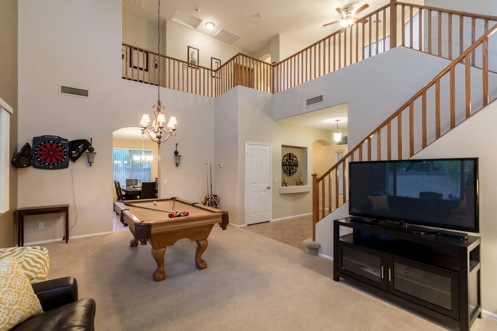 large flatscreen tv's loft on the right w futon sofa master upper left