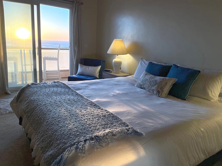 Ocean front master bedroom with king bed, fireplace, and balcony.  Quiet and serene.