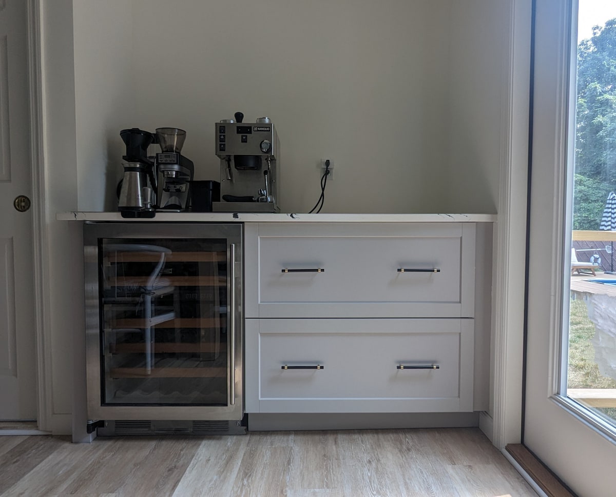 Coffee bar with Moccamaster drip coffee, coffee grinder and Rancilio dual boiler espresso machine. Wine fridge