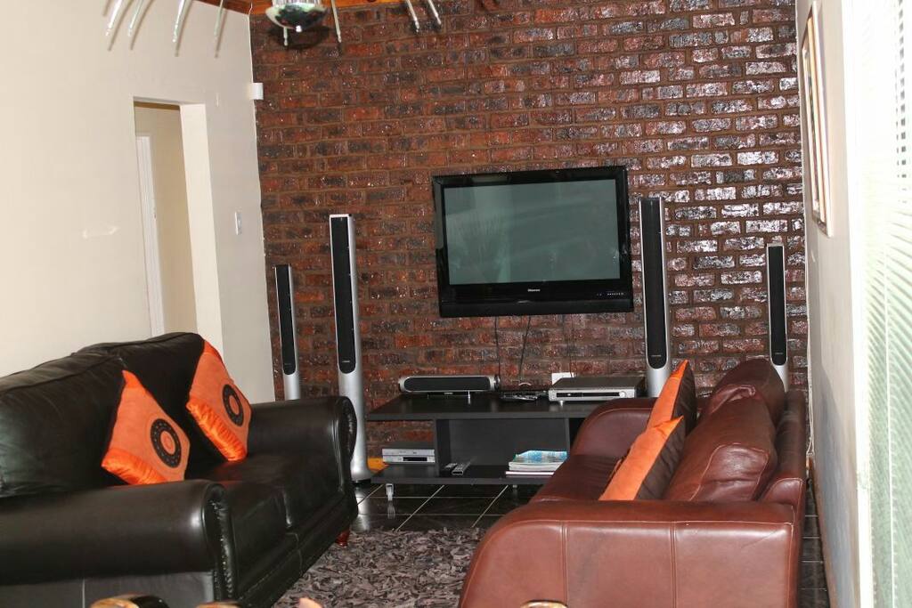 Lounge with TV(DSTV) and sound system.