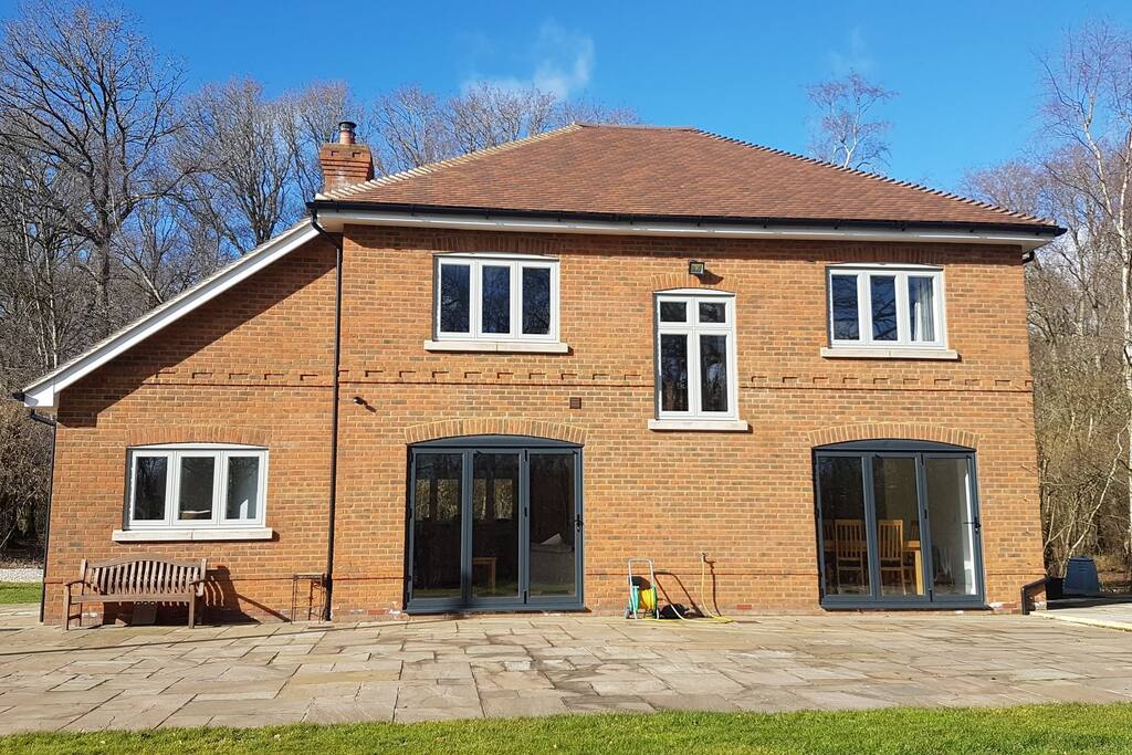 rear view showing patio area. outside furniture there during the summer