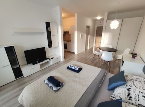 Modern studio with balcony in a new building