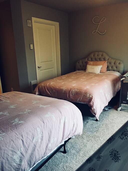 Bedroom with 2 double beds, tent, and keyboard