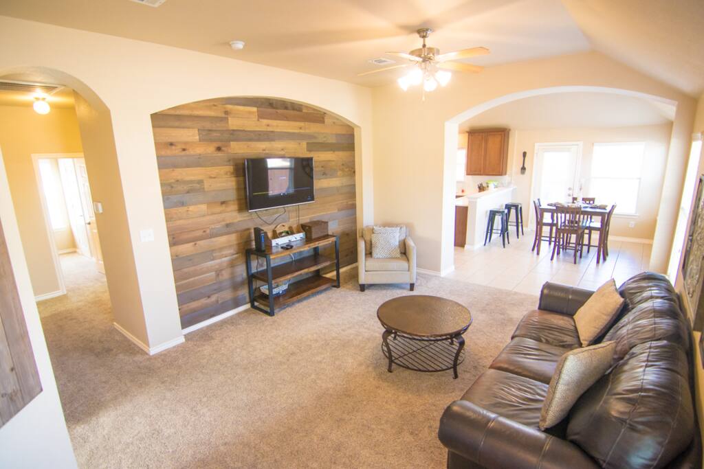 Recent furniture updates and a reclaimed wood wall off set by an HD flat screen make for an enjoyable space with natural lights and a pretty garden to look at.