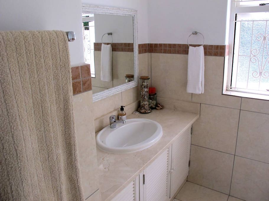 Bathroom with bath and shower over bath