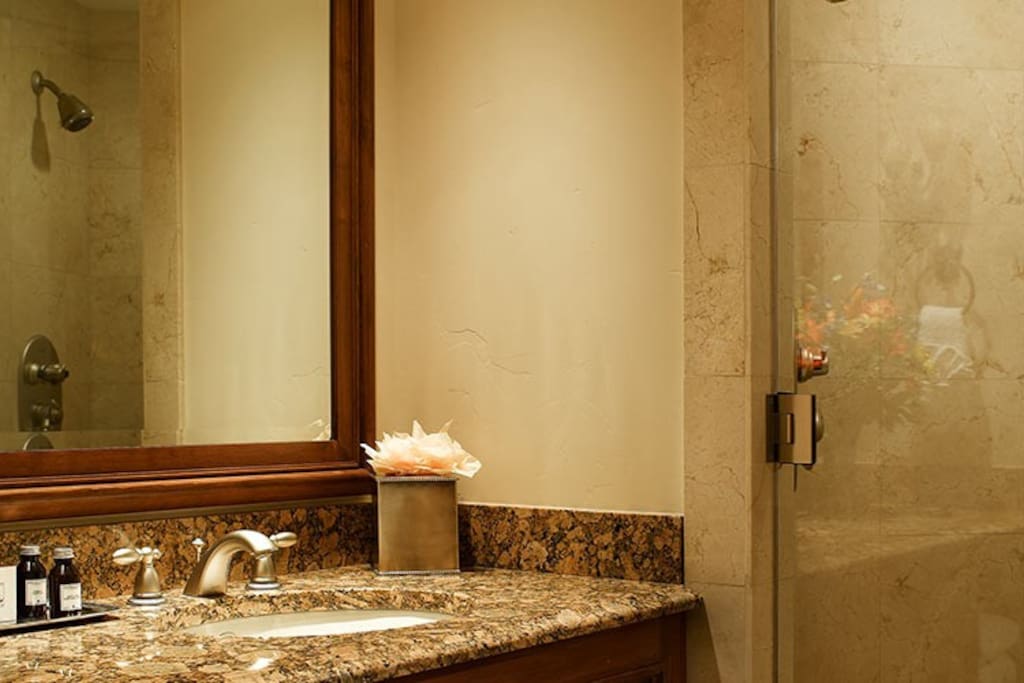 Get ready for your day in the pristine bathroom.