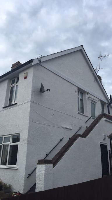 External stairs to private independent front door. Both sides of stairs have hand rails and nonslip stair covering.