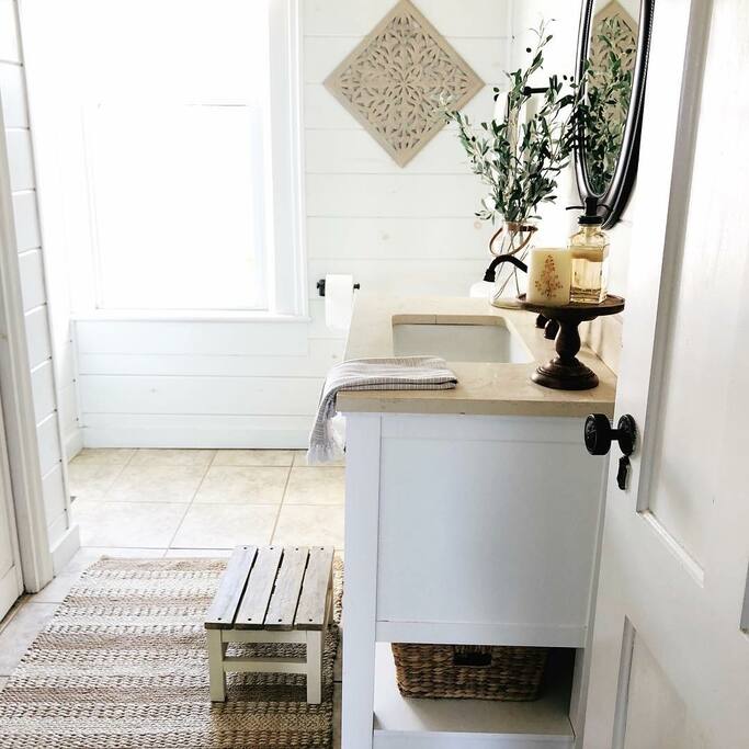 The half bath and laundry room on the first floor is centrally located for easy access for all guests.