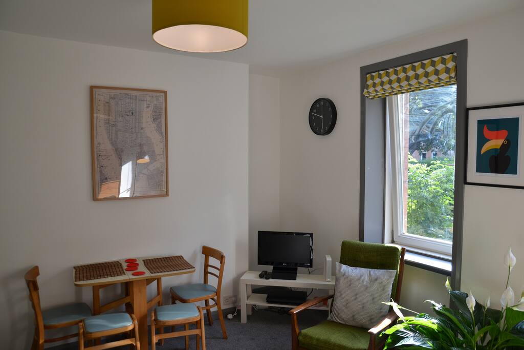 Living Room with small dining area & TV with Virgin TV & Netflix