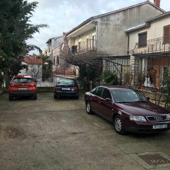 View of back yard where guests can park their car. Note that your park place is on place where is parked Audi. Your car will be in fenced yard, and your place will always wait for you. As place is near yard entrance door you will be never blocked by another car.