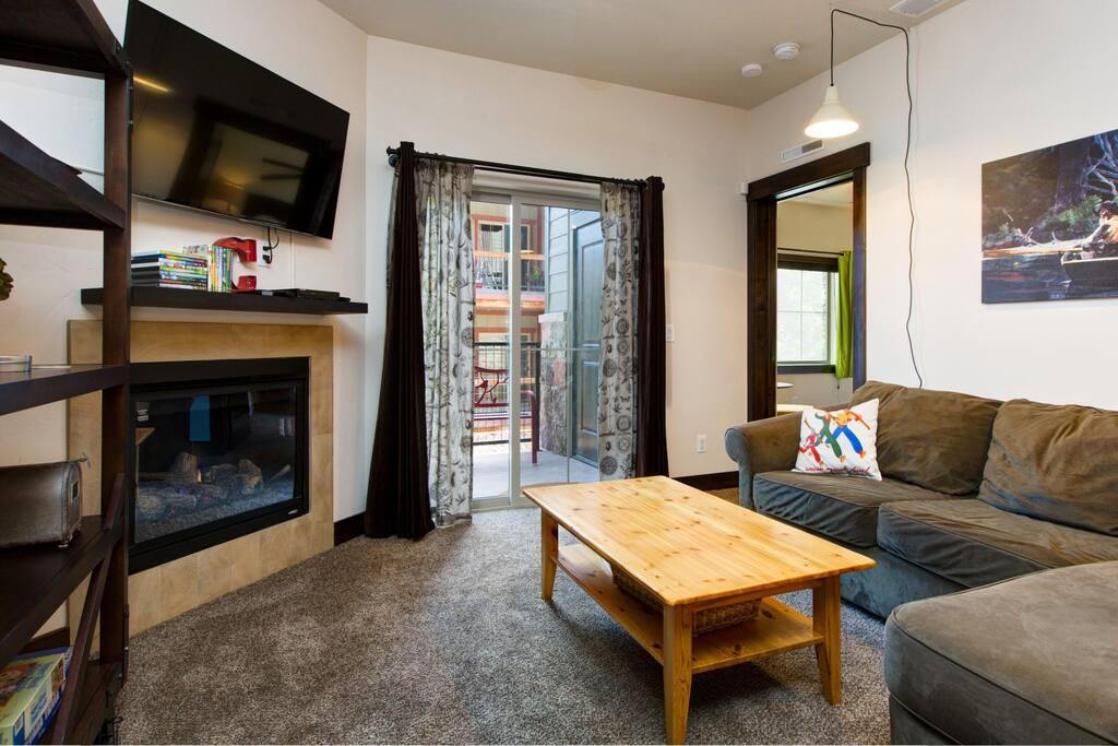 Flatscreen TV, gas fireplace and a comfy sectional that converts to a bed.