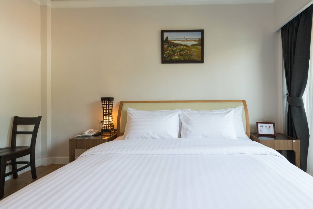Comfortable king size bed with balcony.