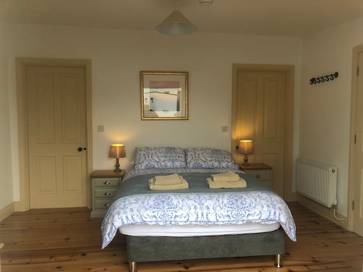 Large double bedroom with en suite bathroom. Full WFI throughout the apartment.