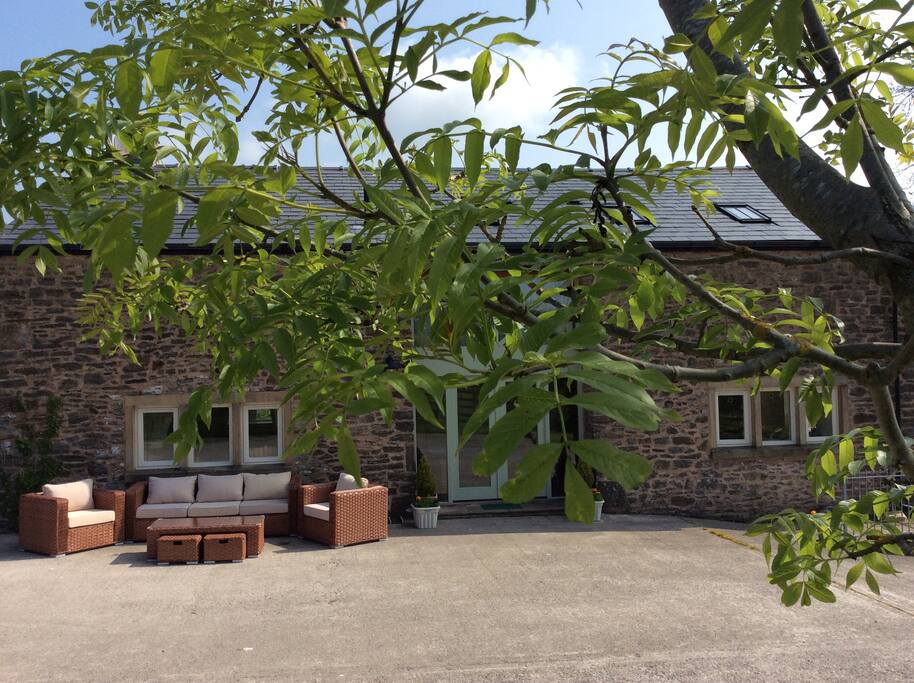 Private seating area with view across the hay field and fells and river beyond. Charcoal BBQ available along with a fire pit. Full size table tennis table to entertain the kids and adults kept in the open fronted garage so rain won't stop play!