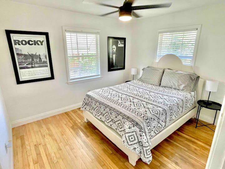 Queen sized bed, ceiling fan, and bedside lamps with built in USB port for your convenience. 