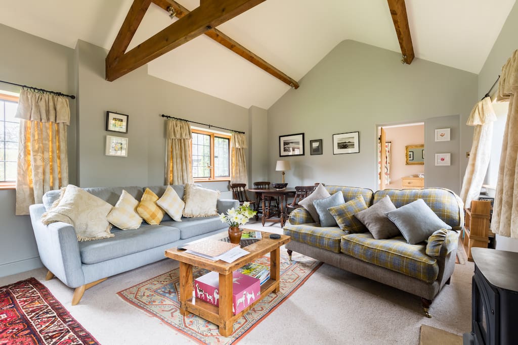 Spacious sitting room with gas effect log burner