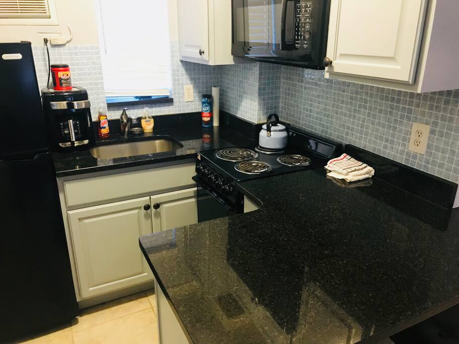 Full Kitchen w coffee maker and unlimited supply of coffee