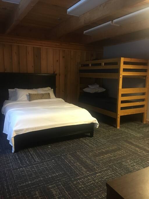 Main Floor Bedroom has a queen and a bunk bed.