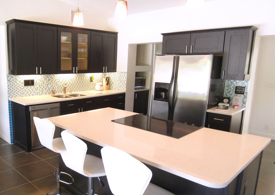 Kitchen & Bar features stainless appliances, large pantry & quartz counters
