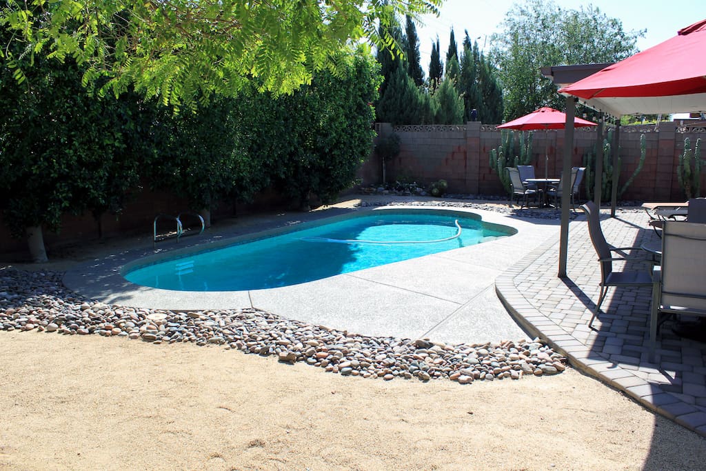 Oasis Backyard, pebble Tec pool, lounge chairs and outdoor dining, BBQ Grill.