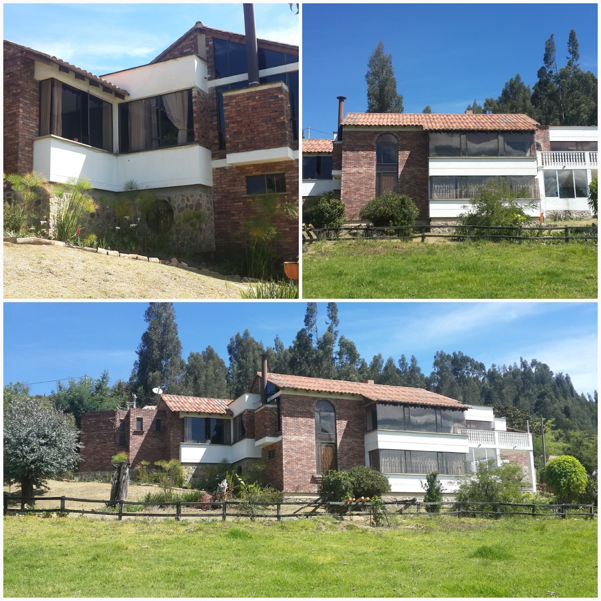 The exterior of a multi-level home is shown, constructed with a combination of brick and large windows. The building features a tile roof and is surrounded by green grass and trees, providing a scenic view of the nearby landscape.