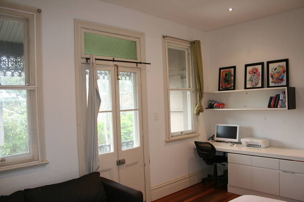The doors open out onto the balcony at the front of the house.
