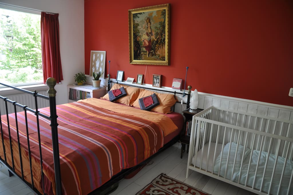 First bedroom, with double bed and baby/toddler bed