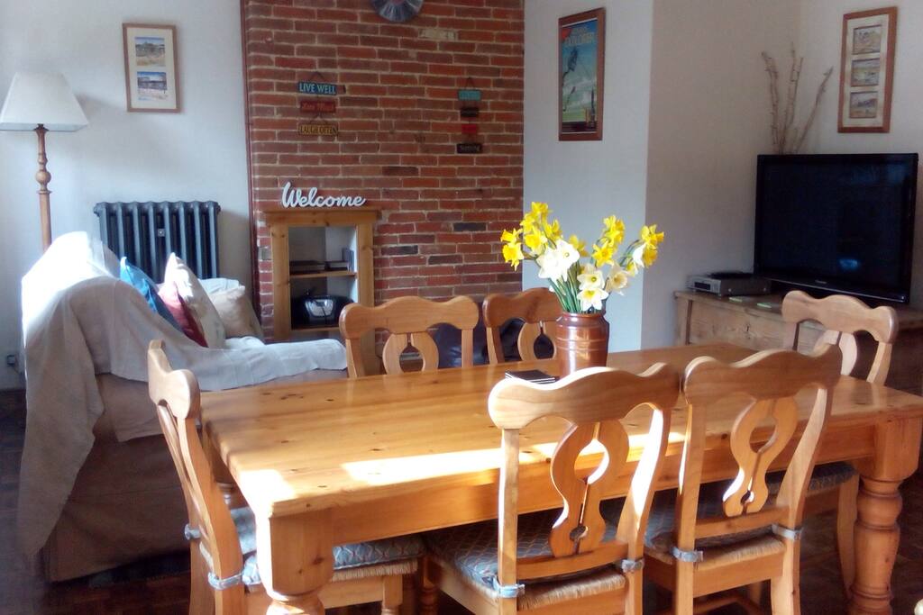 Spend time in the living room dining or playing games around the farmhouse table. There is a collection of DVD's to watch on the 42" flat screen TV.