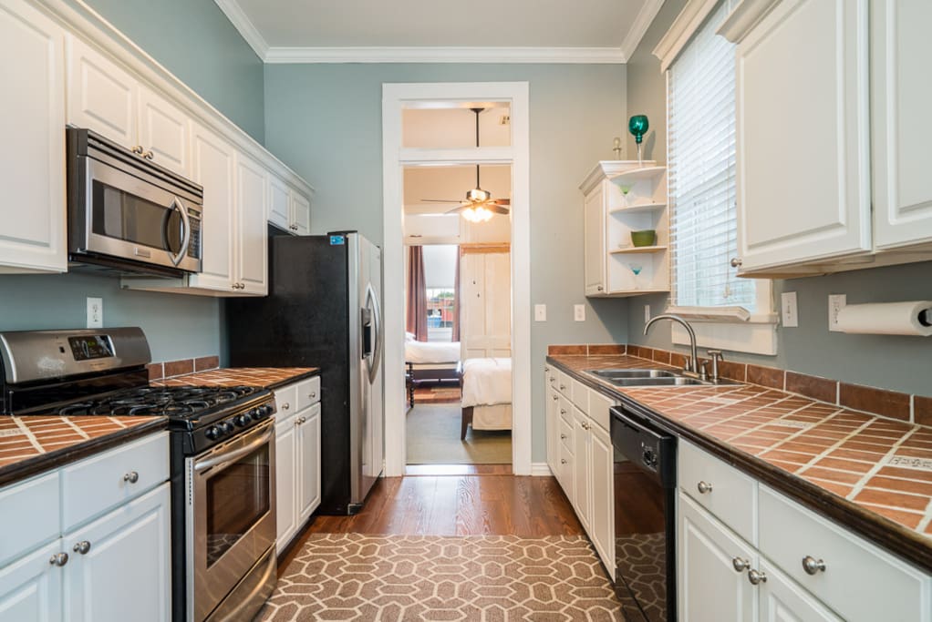Fully equipped kitchen with fridge/ice maker, gas range, microwave and dishwasher plus all cooking needs