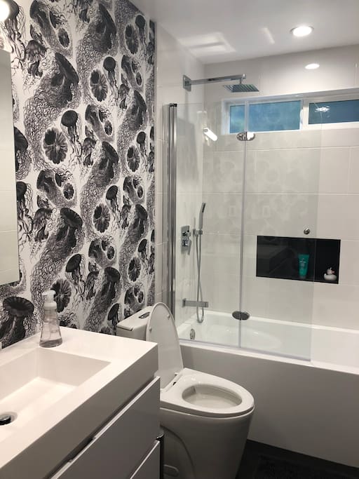 Brand new bathroom with underfloor heating, shower and bath.