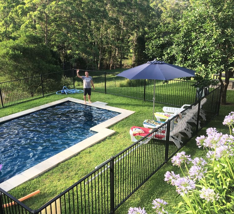 Great salt water pool, overlooking green pastures.