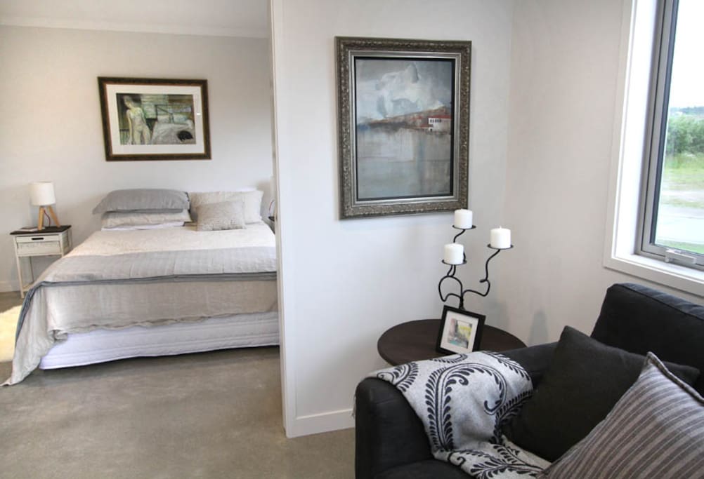 Queen Bedroom separated by sliding doors.