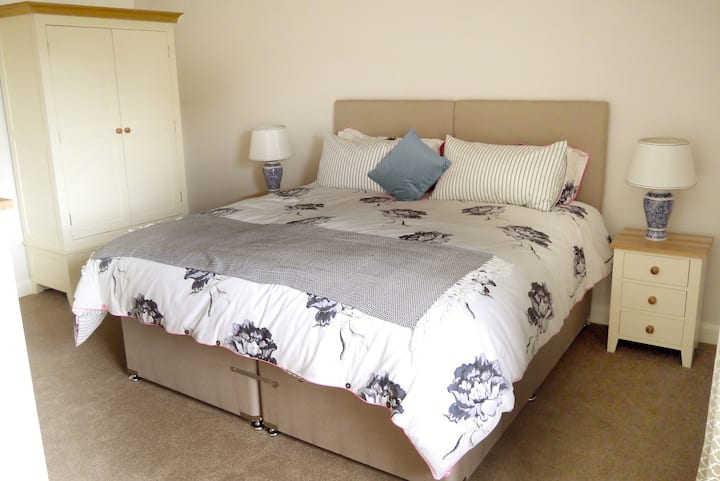 Bed can be split into twin singles.