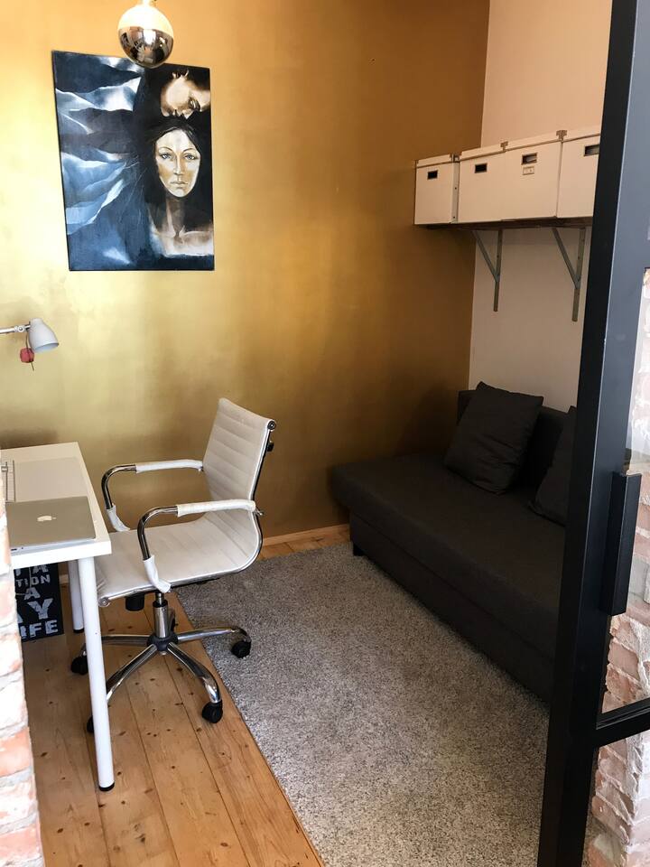 Extra bedroom with a sleeping couch and a working space