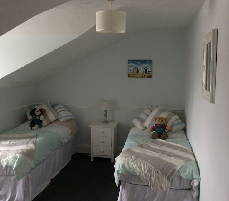 Attic bedroom with views of the rear. Can be a double or twin room.