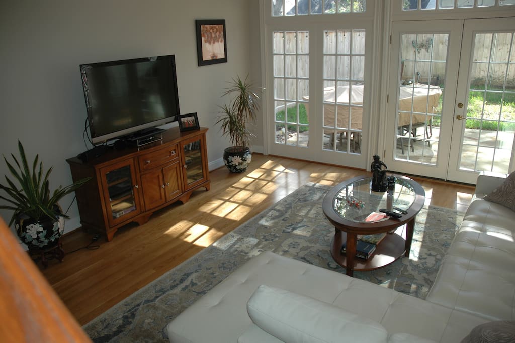 Plenty of room in our family room with an equipped entertainment center and its open to the kitchen