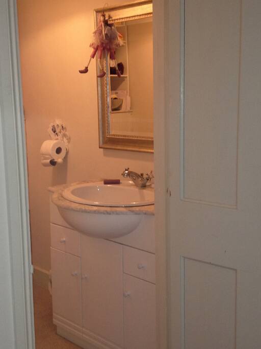 Basic en suite toilet and sink off in adjourning bedroom