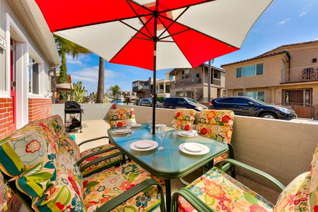 Colorful front patio where you can barbecue and dine al fresco or even watch the sun rise with your morning cup of coffee.