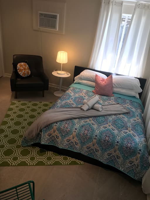 Queen bed in living area