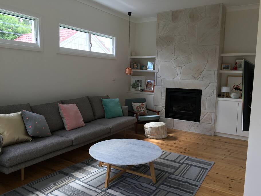 Living area with gas fireplace, flat screen smart TV