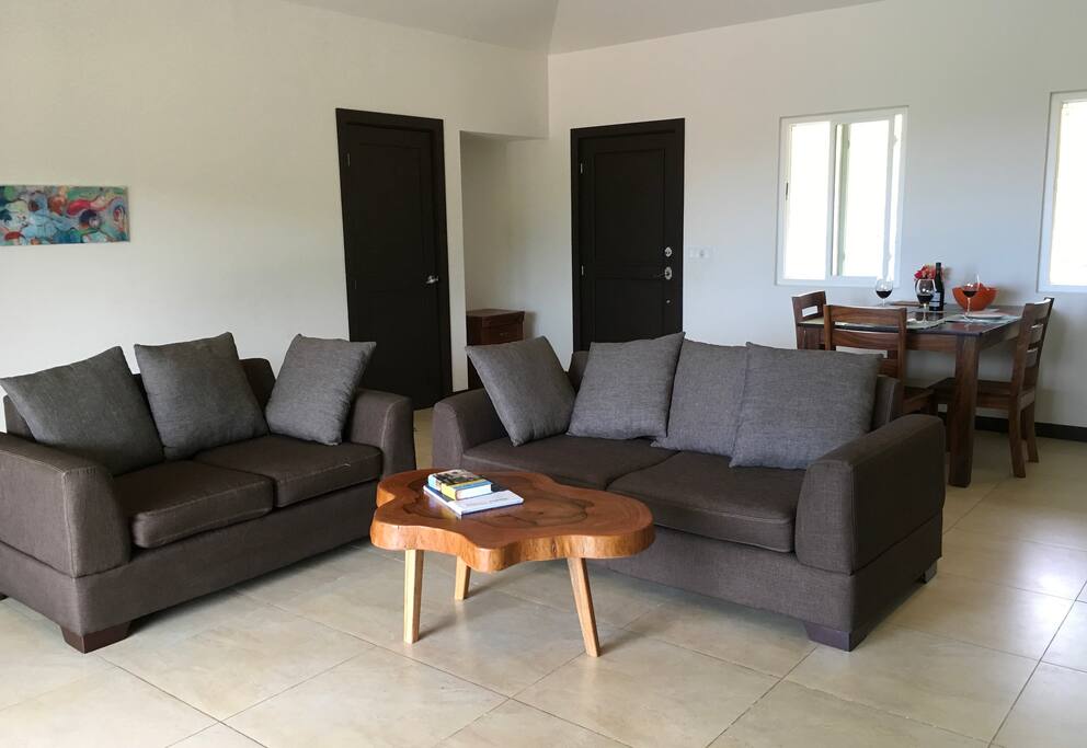 Comfortable, light living area. 40" flat screen TV opposite couches.