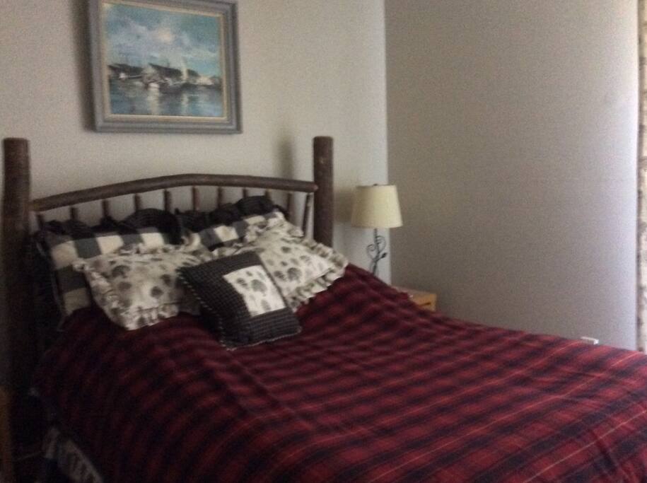 Master bedroom queen bed, Juliet balcony with sweeping view of mountains in winter and birches in summer.