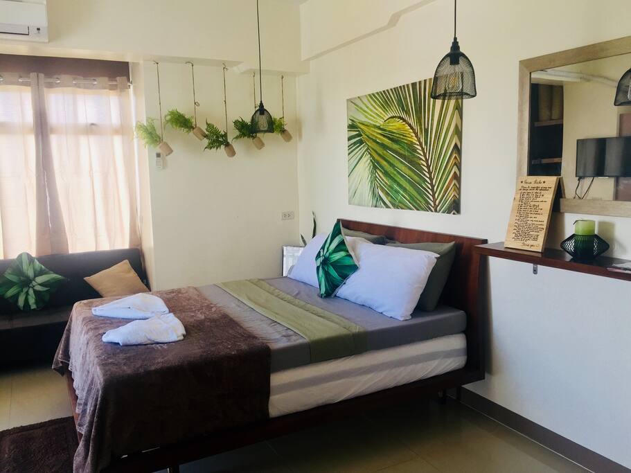 Queen size bed with additional removable queen size mattress.