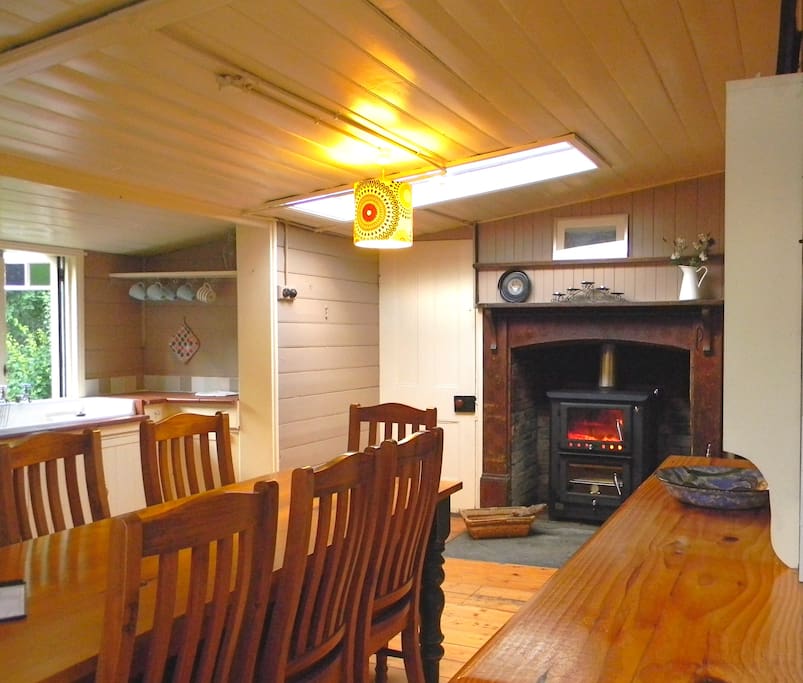 Cosy kitchen with a wood fired heater and oven