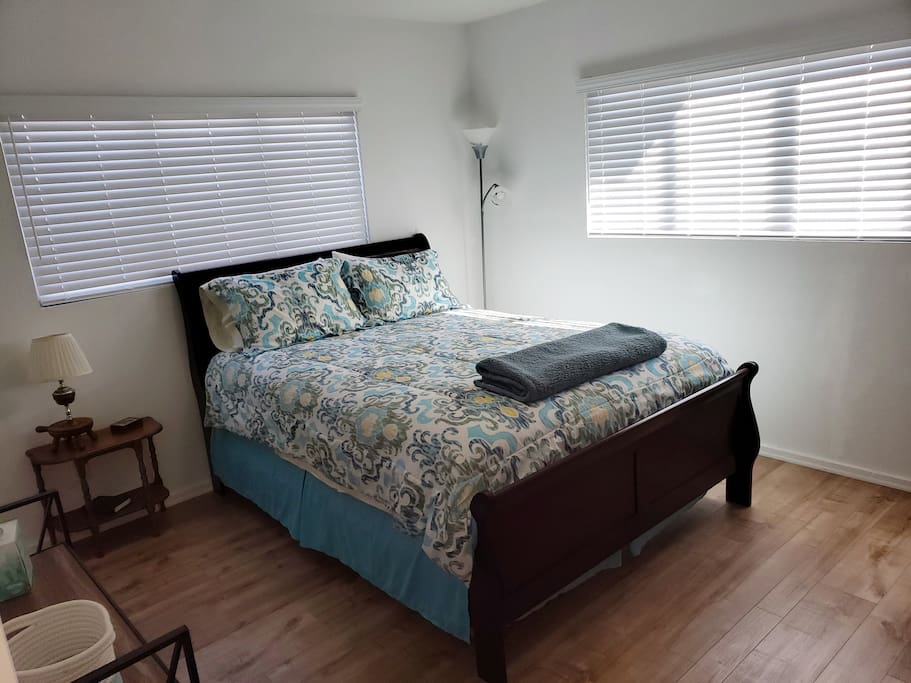 Bedroom #1 with queen-size bed and private bath.