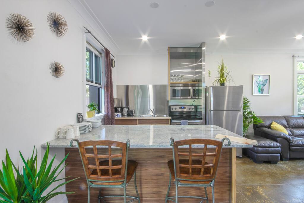 Kitchen; marble breakfast counter-top, stove, oven, microwave, fridge freezer, toaster, coffee pot, kettle, dishes, cooking pots + pans and so much more!