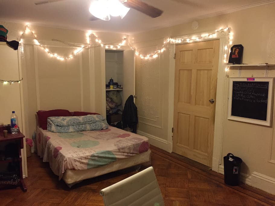 Bedroom Pic #1 (guest closet, entrance, xmas lights & large bed)